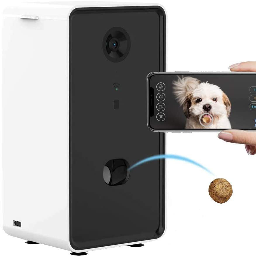 Smart pet feeder with a phone displaying a dog and a treat, on a white background