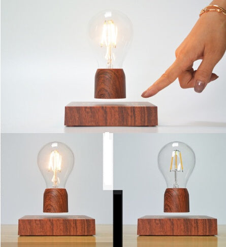 Wooden block with a levitating light bulb on a white background