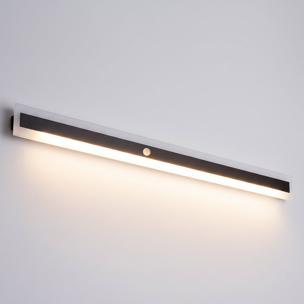 A slim rectangular LED under-cabinet light bar with a white outer frame and a dark gray central panel, shown diagonally on a plain white background.