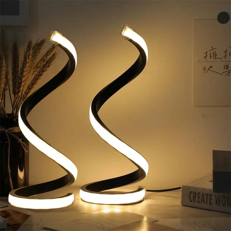 Modern spiral table lamp on a desk with a warm glow