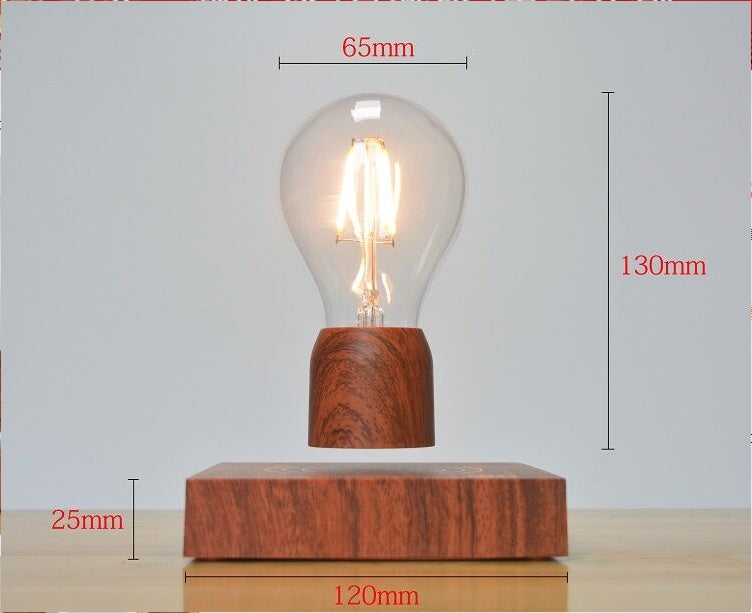 Wooden base with levitating light bulb on a gray background
