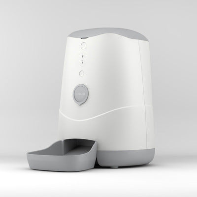 White and gray pet feeder on a light gray background
