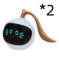 Toy figure of a cat with a surprised expression on a white background