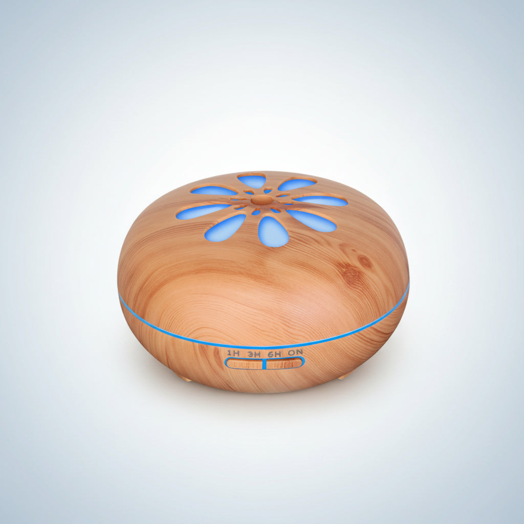 Wooden diffuser with blue LED lights on a white background