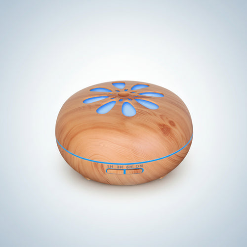 Wooden diffuser with blue LED lights on a white background