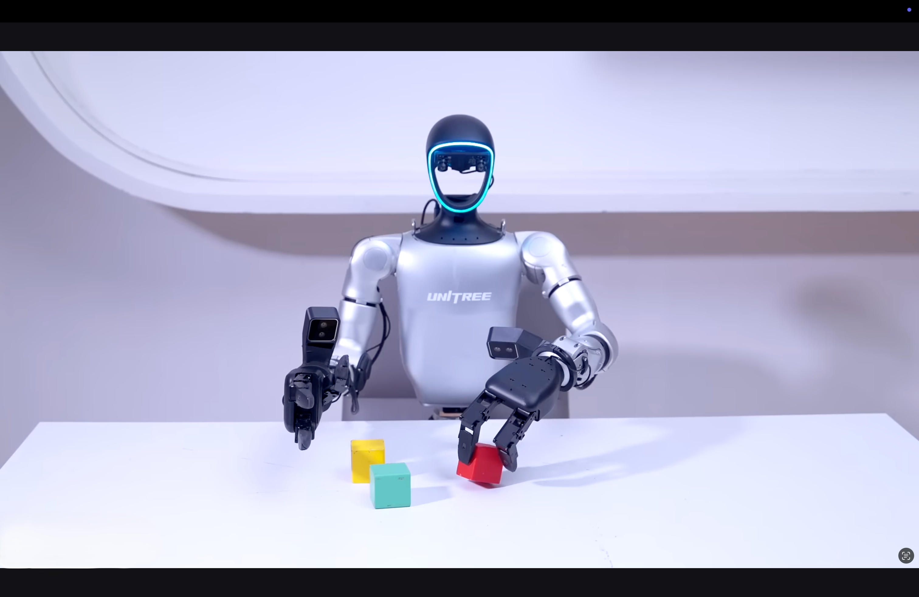 Robot with colorful blocks on a white surface