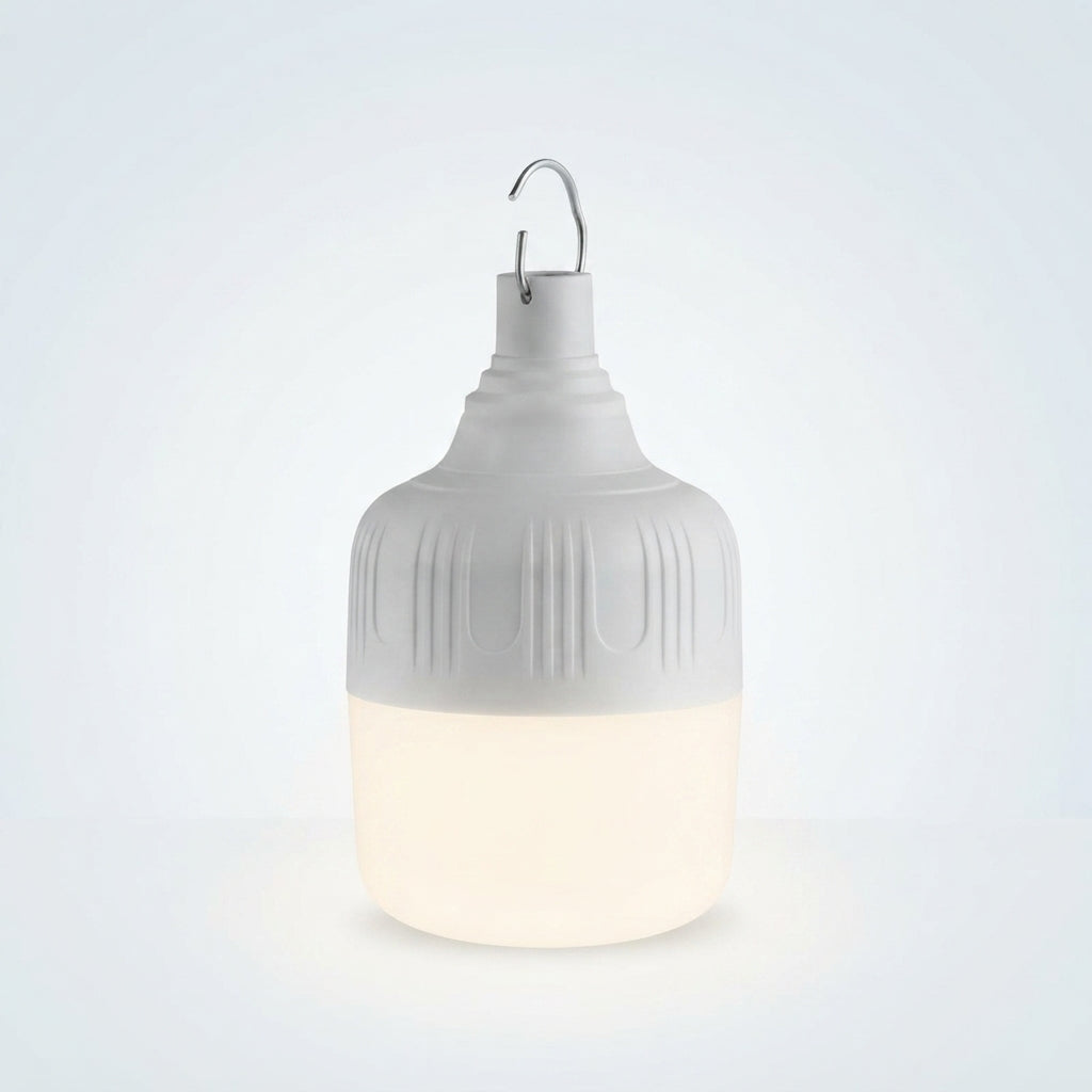 A modern hanging lantern with a ribbed white plastic upper section and a glowing warm white lower section, suspended by a metal hook against a light gray background.
