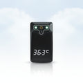 A black digital thermometer pocket clip with a glossy finish, featuring a white LED display showing 36.3°C and a green temperature scale, resting on a white surface.