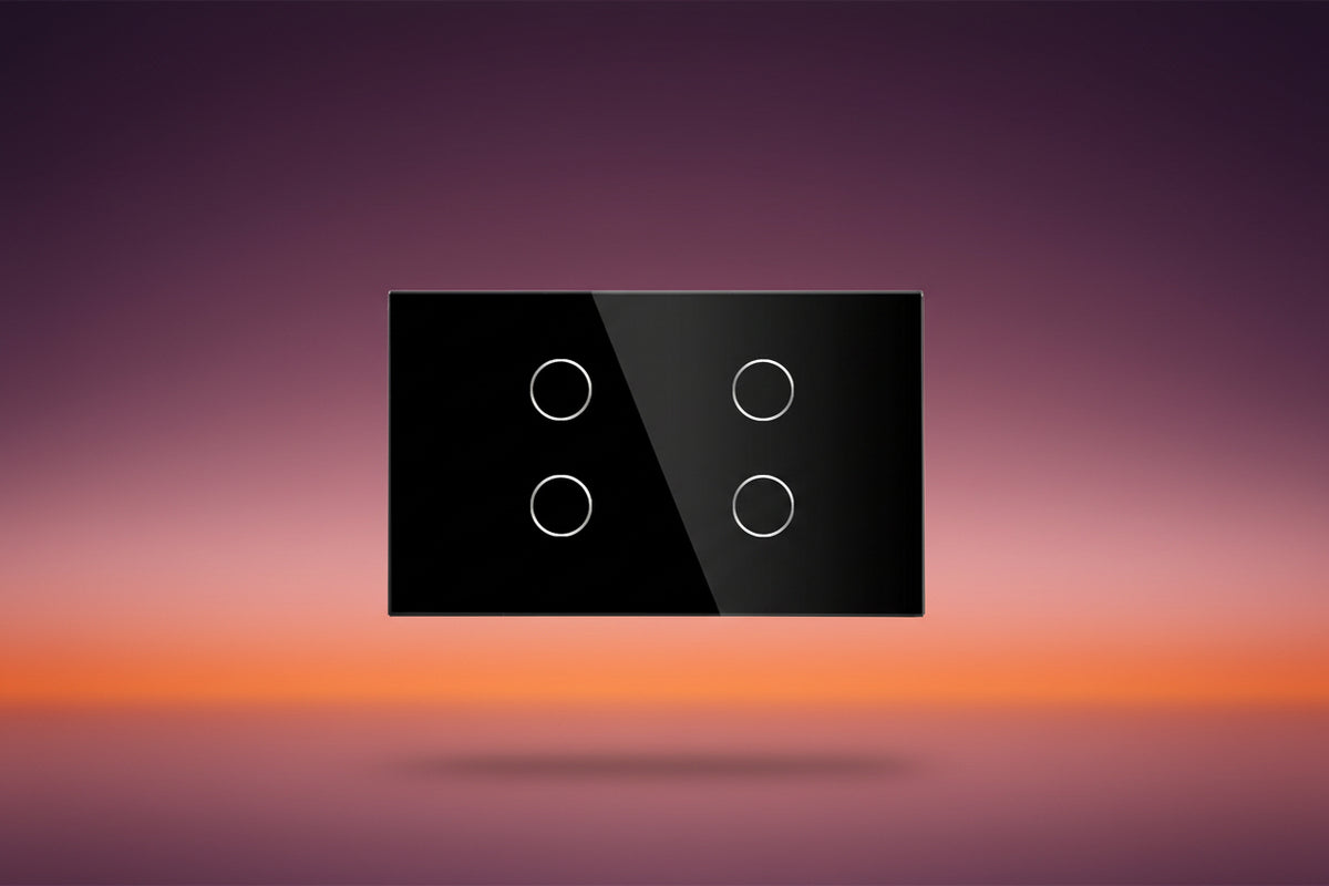 Black rectangular panel with four white circular buttons on a white background