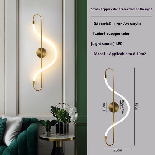 S-shaped wall sconce with a copper/bronze finish and glowing white LED light, shown mounted on a wall in a modern interior. The right side includes product specs and dimensions for a small version of the sconce.