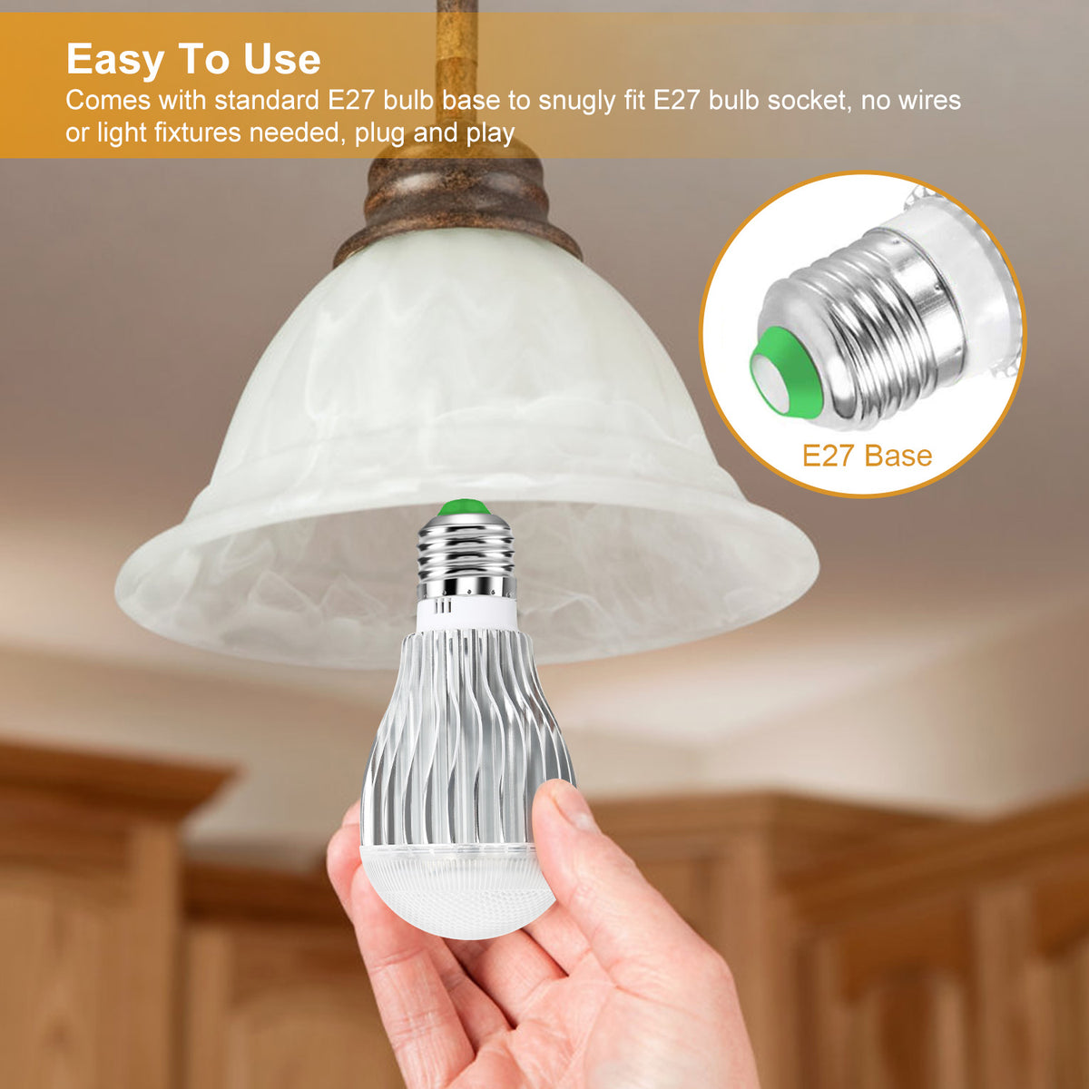 Hand holding a LED light bulb with E27 base, ceiling lamp in background