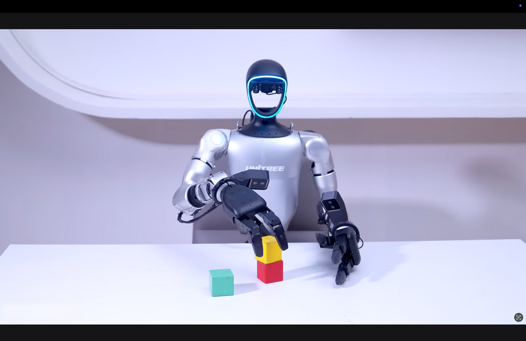 Robot with a helmet and colorful blocks on a white surface