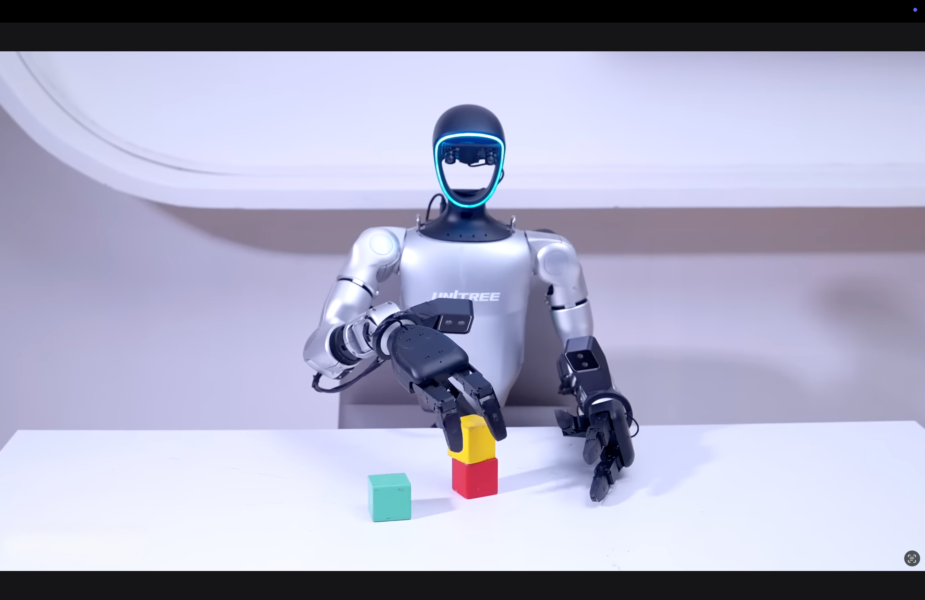 Robot with a helmet and colorful blocks on a white surface