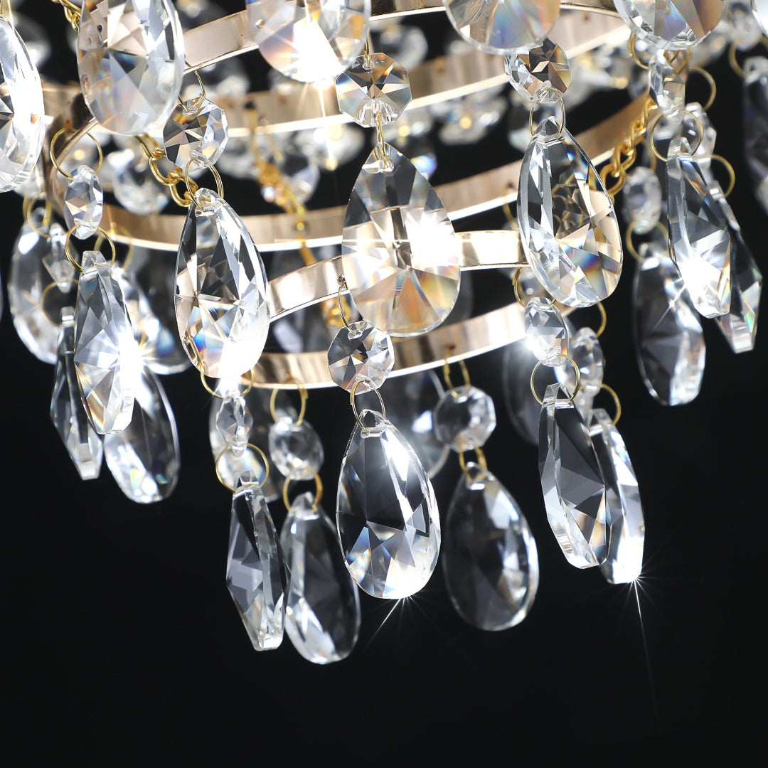 Close-up of a chandelier with crystal beads on a black background