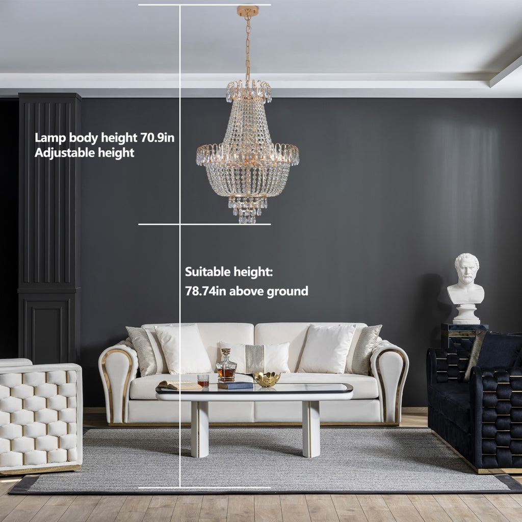 Living room with a chandelier, sofa, and decorative items on a gray wall background.