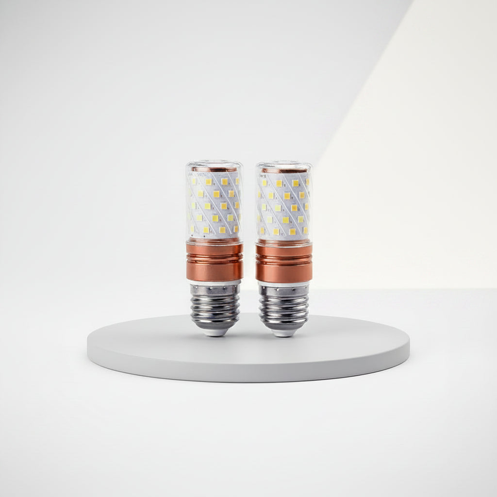 Two LED light bulbs with copper accents on a white background